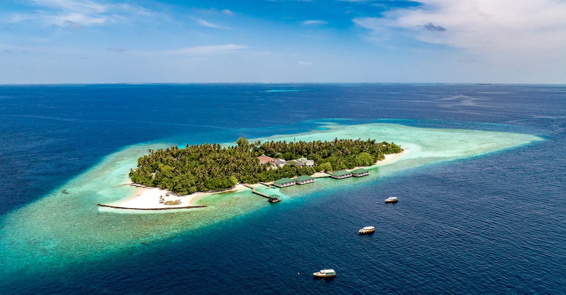 Embudu Village Maldives: A Traditional Resort with a Remarkable House Reef